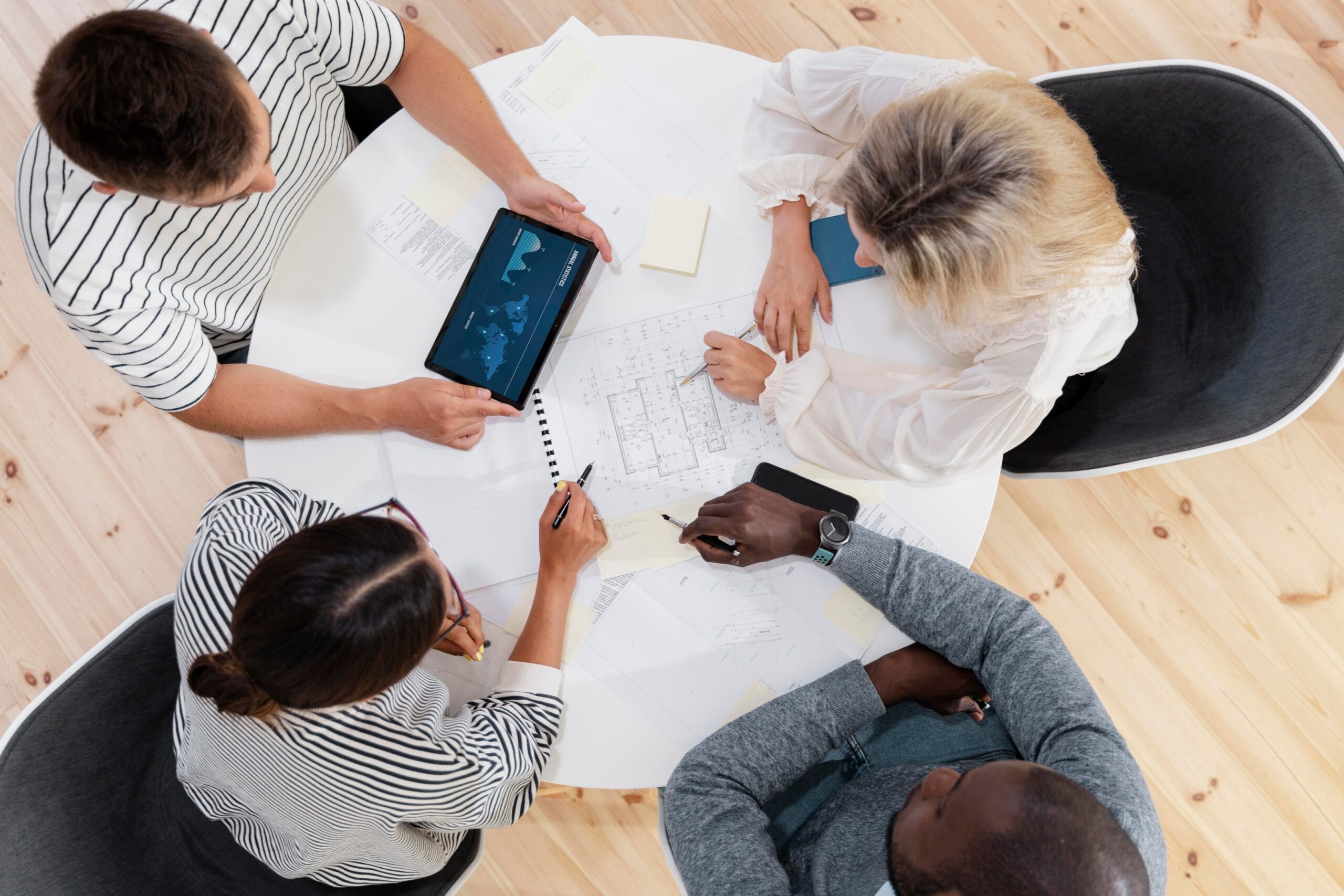 four person creating a design